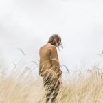 Confidence Solo - person standing in the middle of wheat field