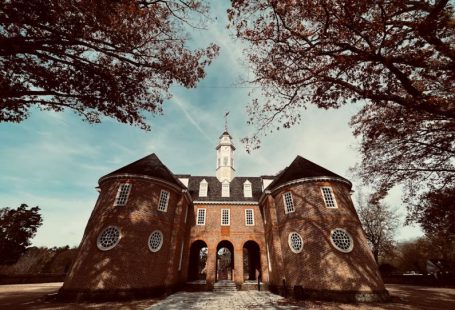 Colonial Williamsburg - a large brick building with a clock tower
