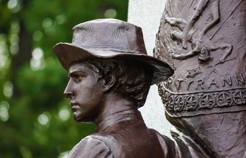 Gettysburg Battlefield - a close up of a statue of a man wearing a hat