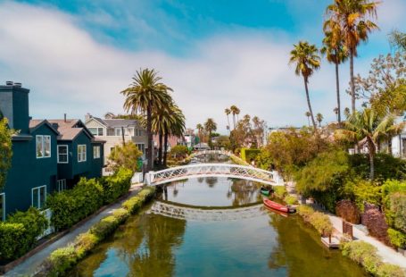 Venice Canals - selective focus photography of small bridge and body of water during daytime