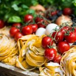 Italian Food - yellow pasta and cherry tomatoes