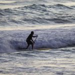 Hawaii Surfing - man in black wet suit surfing on sea waves during daytime