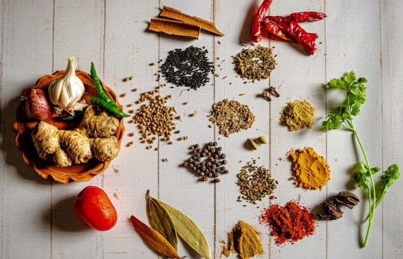 Indian Spices - a variety of spices on a white table