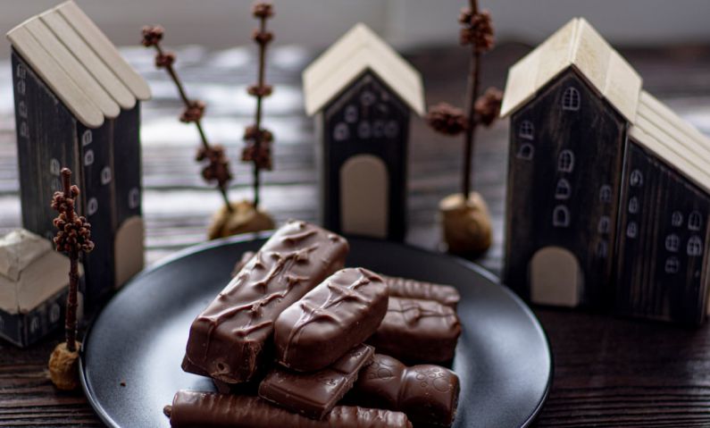 Chocolate History - chocolate bar on black plate