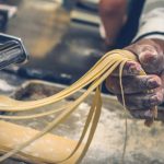 Italian Pasta - person sheeting dough