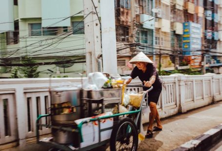 Thai Street Food - man pushing the cart on street